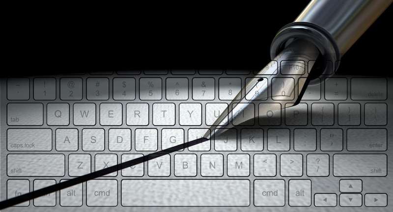 Image of pen writing across keyboard