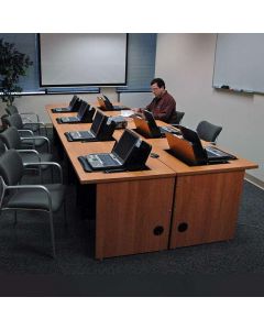 An Individual working at a Computer Conference Table with concealed monitor mounts for 8 laptop computers